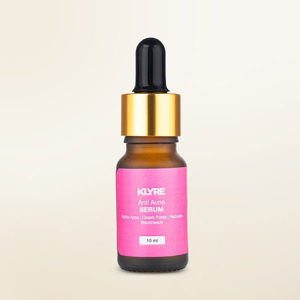KLYRE anti-acne serum bottle with pink label on a beige background