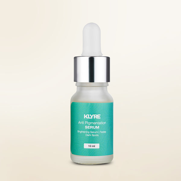KLYRE anti-pigmentation serum bottle with dropper on a beige background