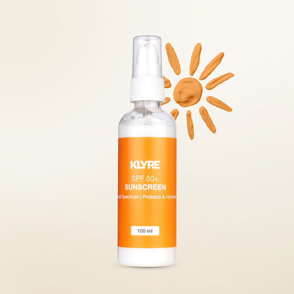 KLYRE sunscreen spray bottle with an orange label on a beige background